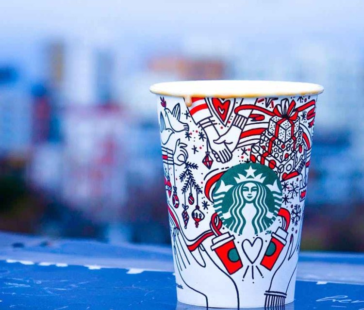 close up photo of white and red starbucks disposable cup
